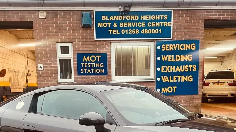 The Blandford Heights MOT and Service Centre sign above the workshop